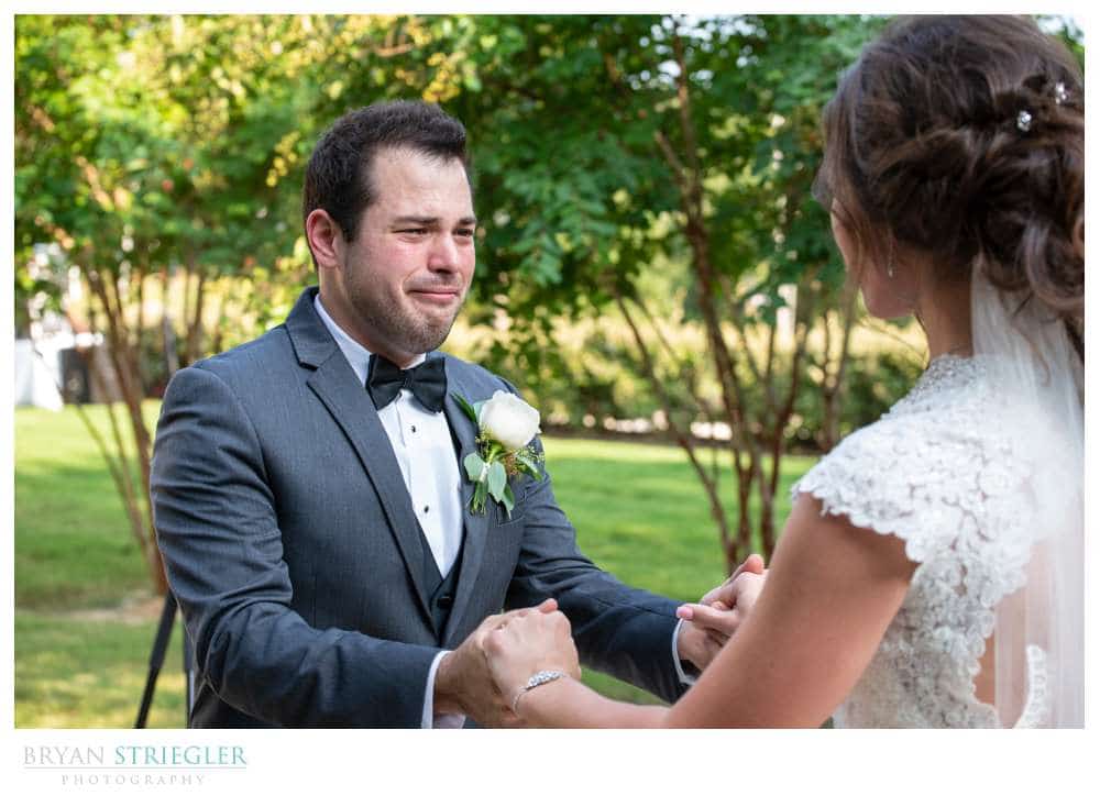 groom crying during first look